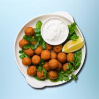 Funky Falafel Plate · Platter served with falafels, rice, lettuce, and tomatoes along with a choice of toppings an...