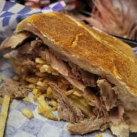 Cubano Sandwich · Marinated pork, ham, Swiss cheese, pickles, and mustard.