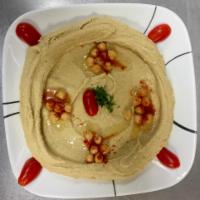 Homemade Hummus · Mashed chickpeas blended with garlic, sesame and herbs.