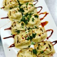 Uzbek Mantu · Homemade dumplings with lamb meat and onion inside.