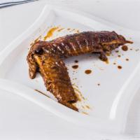 Turkey Wing · comes with two turkey wings and choice of two sides. Turkey wings are stewed in brown gravy ...