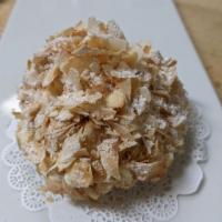 Coconut Cream Tart · A buttery tart shell filled with coconut cream and covered in toasted coconut ribbons and po...