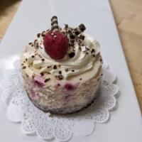  Raspberry Cheesecake · A raspberry cheesecake on a chocolate crust, topped with white chocolate mousse 