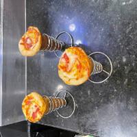 Sausage Pizza Cone · Hot and Delicious  pizza crust filled with cheese, sausage and pizza sauce.