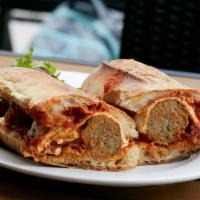 Meatball Parmigiana Sandwich · Homemade meatballs topped with fresh mozzarella and marinara sauce.