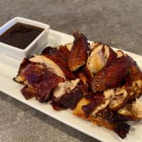 Golden Crispy Chicken · Fresh whole chicken marinated in soy sauce and spices then deep-fried to a golden crisp. 
