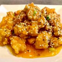 Sesame Chicken  · Crispy chicken wok-tossed in a house special tangy sauce and sprinkled with black and white ...
