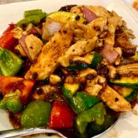 Chicken with Black Bean Sauce  · White meat chicken stir fried in black bean sauce with red bell peppers, red onions, and zuc...