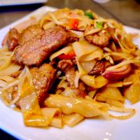 Beef Chow Fun · Flat rice noodles stir-fried with flank steak, red bell pepper, green onions, red onions, be...