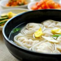 25. Korean Dumping Soup (Monduguk) · Homemade beef bone marrow broth with green onion and Mama's homemade vegetable dumplings.
