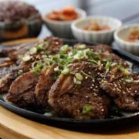 19. Beef Short Rib (Galbi) · Grilled beef short ribs marinated with a garlic soy sauce. Served with side of rice, doenjan...