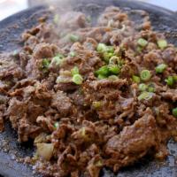 20. Marinated Beef (Bulgogi) · Marinated thin slices of choice cut rib eye. Served with side of rice, doenjang sauce, and b...