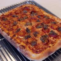 Back Home Pie · Red sauce and mozzarella mixed together, cup n char pepperoni, house Italian sausage, finish...