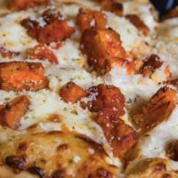 Chicken Finger Pizza · Naked City blue cheese dressing, mozzarella and chicken fingers tossed with Frank's Red Hot.