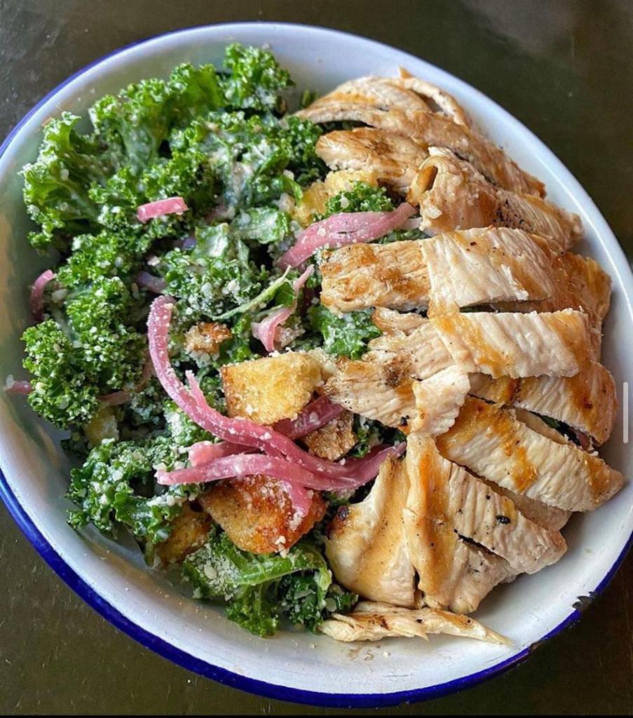 KALE SALAD · pickled onions, garlic croutons & parmesan add grilled chicken $4, add fried egg $2
