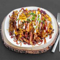 Texas Fries · Our fresh cut fries topped with our slow-smoked chopped brisket, onions, chives, sour cream,...