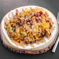 Bacon Cheeseburger Fries · Our fresh cut fries topped with seasoned ground beef, crispy bacon pieces, cheddar cheese, a...
