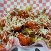 Buffallo Hot Fries · Our fresh cut fries topped with crispy spicy Buffalo chicken fingers, jalapenos, and Parmesa...