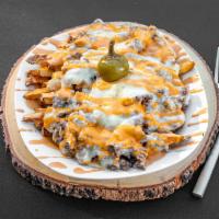 Philly Fries · Our fresh cut fries topped with fresh thin sliced ribeye, peppers, onions, provolone cheese,...