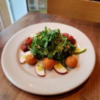ENSALADA CON QUESO DE CABRA · breaded fried goat cheese, Baby arugula, roasted pumpkin seeds, onions, tossed with jalapeño...
