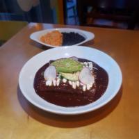 ENCHILADAS  · 3 enchiladas in our traditional mole poblano sauce,Choice of steak, pork or chicken served w...