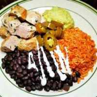 PLATO DE CARNITAS · slow cooked fresh ham pork, served with Rice a la mexicana, beans, avocado, jalapeños, corn ...