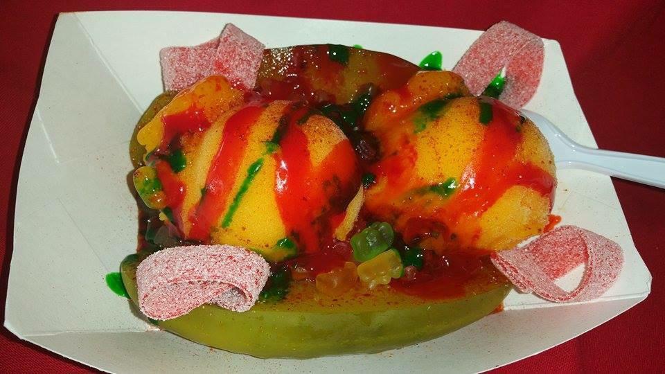 PICKELANDA  · MANGONADA WITH A SLICED PICKLE SOURSTRIPS, GUMMY BEARS, RED CHAMOY, GREEN CHAMOY AND LUCAS 