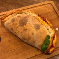 Eggplant Parm Calzone · Eggplant, Cheese, Sauce, Parmesan & Basil. Comes With A Side Of Marinara.
