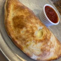 Spinach Calzone · Spinach, Ricotta & Provolone. Comes With A Side Of Marinara.
