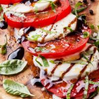 Caprese Salad · Fresh mozzarella, tomatoes, basil, olive oil and balsamic vinaigrette.