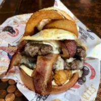 The Brie Cream Burger · A loaded burger with 2 beef patties, brie, cream cheese, secret sauce, onion rings, bacon, f...