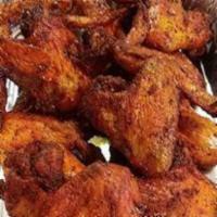 Oven Roasted Chicken Wings · Seasoned with our house blend spices and oven roasted to crisp and tender succulence.
