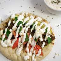 Pita · Warm Pita with your choice of protein and toppings! A Pitabilities classic!