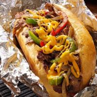 Philly Cheese Steak · Steak, American cheese, peppers and onions on a hero.