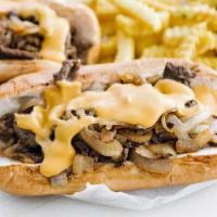 CHICKEN PHILLY CHEESE STEAK · American cheese,peppers & onions