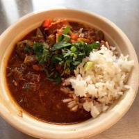 Jo Roux Chicken and Andouille Gumbo · Tender chicken and savory sausage in a traditional dark roux with okra, trinity and rice.