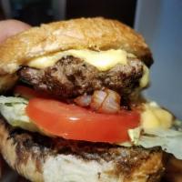 The Parish Burger · A 1/3 lb. chuck patty seasoned with Cajun spice and seared, served with our house made chees...