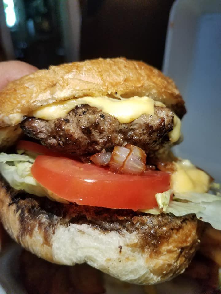 The Parish Burger · A 1/3 lb. chuck patty seasoned with Cajun spice and seared, served with our house made cheese sauce, lettuce, tomato and fried shallots.