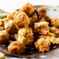 Southern Fried Okra · Fresh okra marinated in a buttermilk blend, lightly dredged in a crispy breading, fried and ...