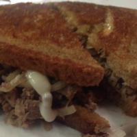 Roast Beef Melt Sandwich · Roast beef, sauteed onions, melted cheddar cheese, and horseradish mayo on white toast. 