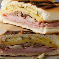 Cubano Sandwich · ( Cuban bread).roasted pork, ham, Swiss y pickles.
