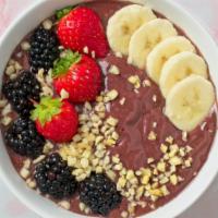 6. Brazilian Blended Bowl  ·  Blended organic acai, wildberry, banana topped with banana, mango, kiwi, berry, granola, ch...