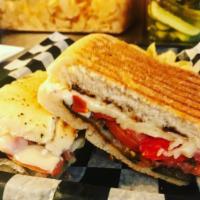 H. Eggplant Parm Pressed Panini · Eggplant, mozzarella, marinara sauce, basil, and parm cheese, pickle and can of Soda or Bott...