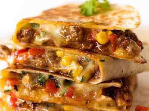 4. Veggie Quesadillas · Grilled peppers, grilled onions, grilled mushrooms, corn, jalapeno, mozzarella cheese, cheddar cheese with salsa.