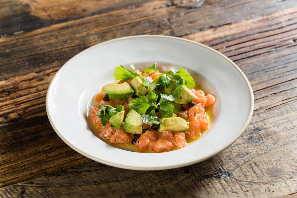 Tartare Di Salmone* · organic salmon tartare, avocado, fried capers, Dijon vinaigrette.  * Consuming raw or under-cooked meats, poultry, seafood, shellfish or eggs may increase your risk of foodborne illness.