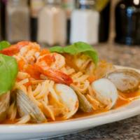 Mediterranean Pasta · Served with clams, shrimp and calamari over pasta.