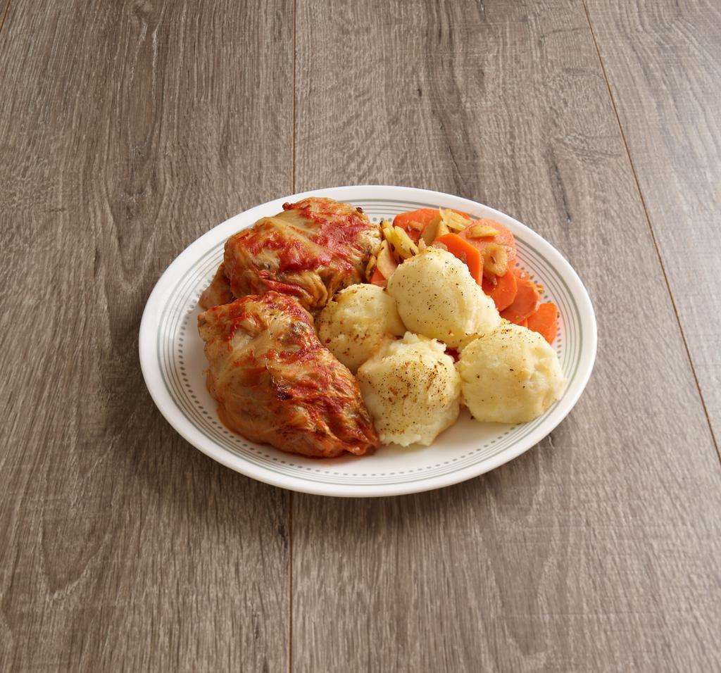 Golabki Plate · Cabbage roll with meat filling. Served with mashed potatoes, carrots with apples, onions and caraway, pickled vegetables, fresh baked bread and polish bread spread (smalec).