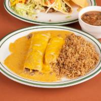 El Acapulco · 2 beef tacos, chile con queso chips, guacamole, beef enchilada, tamale topped with chile con...