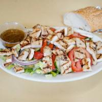 Grilled Chicken Salad · Served with bread and butter.