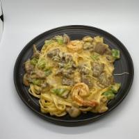 Surf & Turf · Sauteed Shrimp, steak, mushrooms, onions, peppers and fettuccini noodles tossed in smoky alf...
